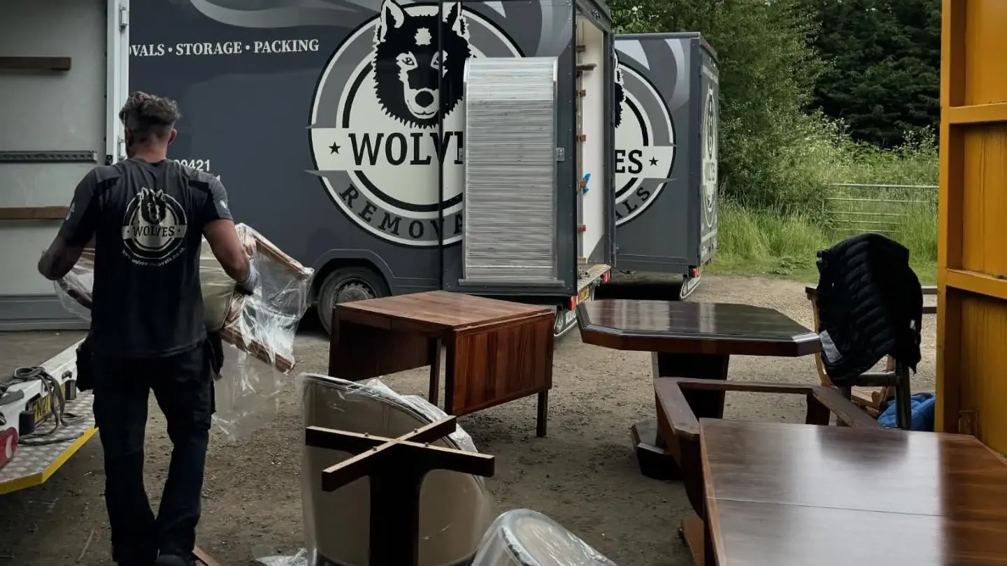 Wolves Removals lorries loading wrapped antique furniture during a dealer stock move