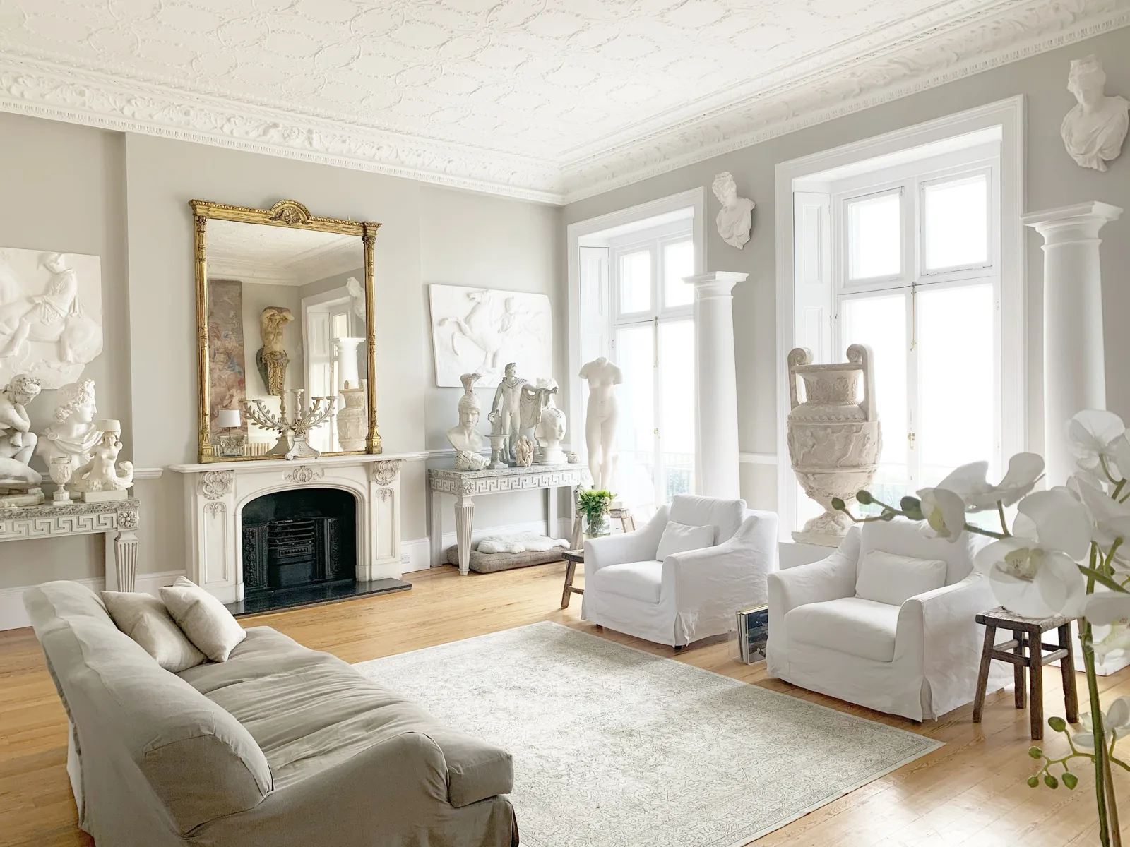 Antique drawing room with fireplace and gilt mirror for a move in Horsham, West Sussex