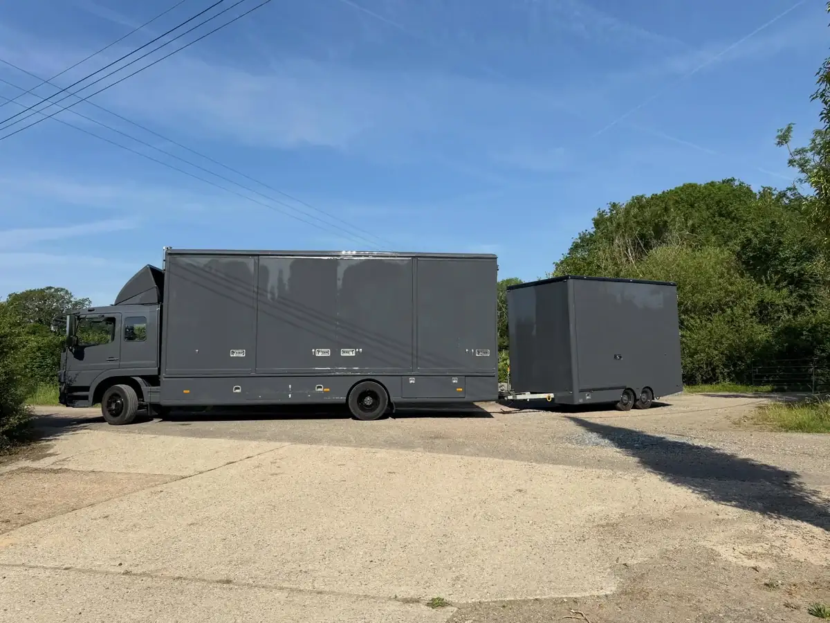 A Wolves Removals lorry and drawbar trailer used to transport an antiques collection