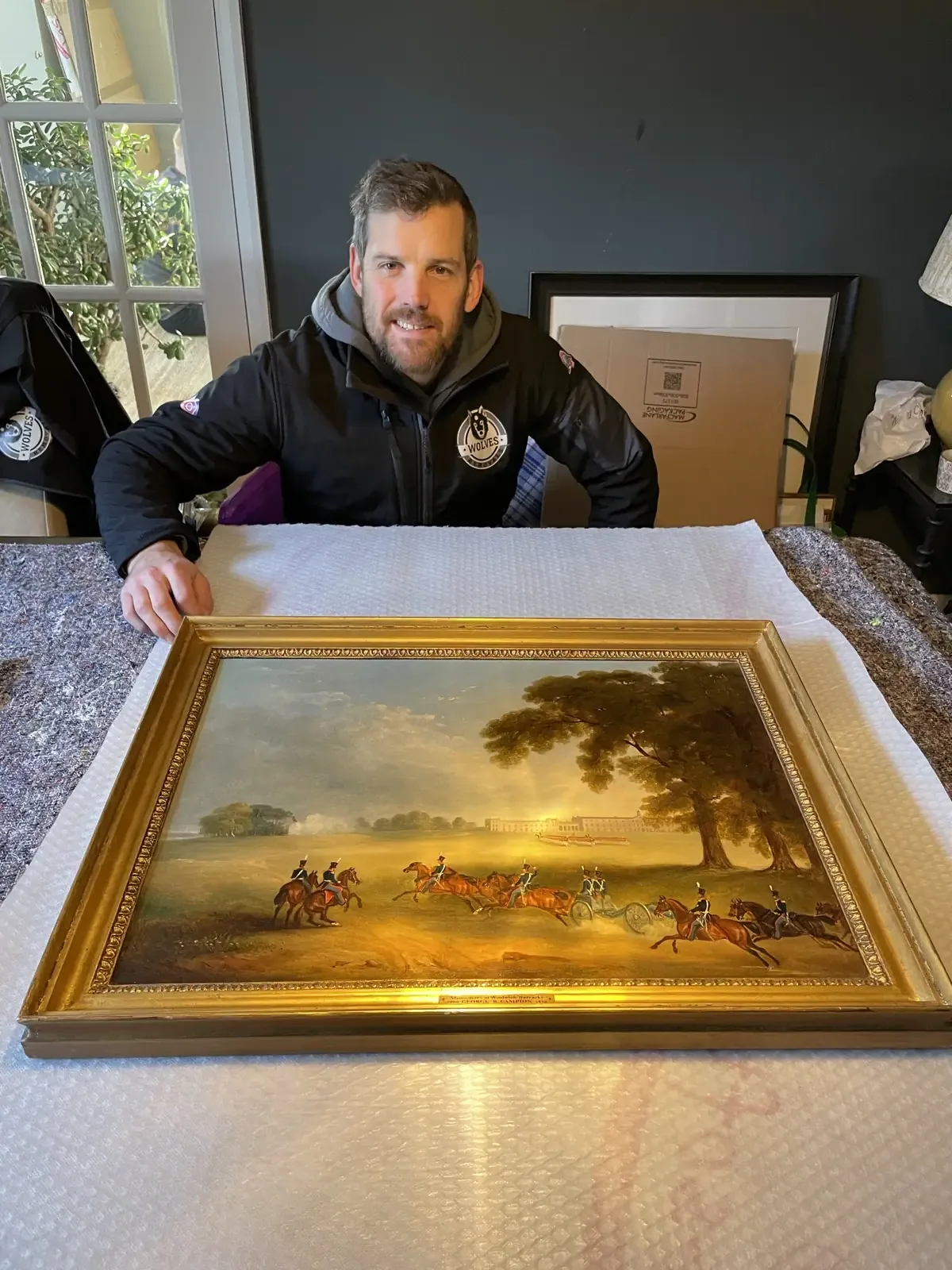 Carrying a gilt-framed antique painting on a Surrey house move