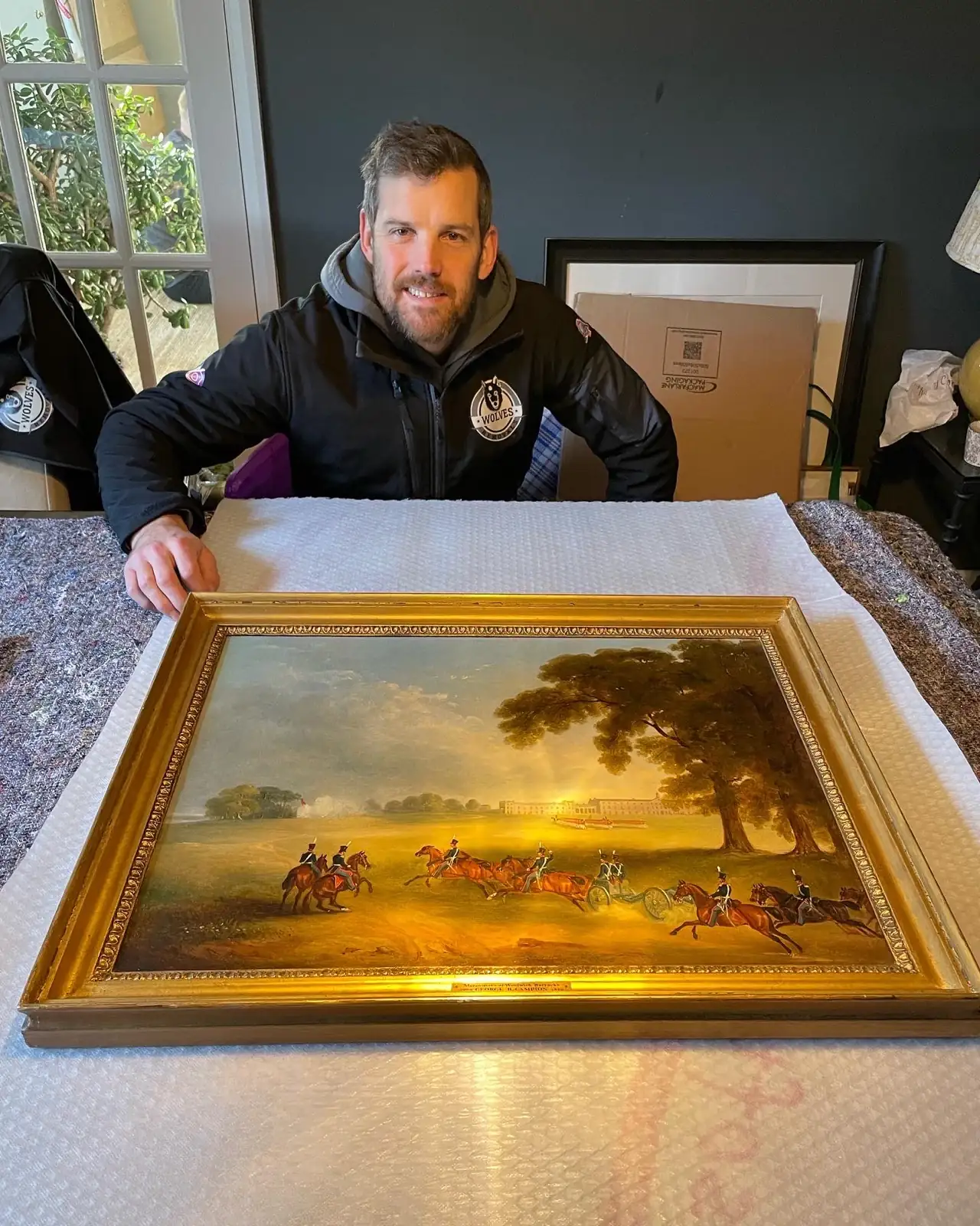 Carrying gilt framed landscape painting