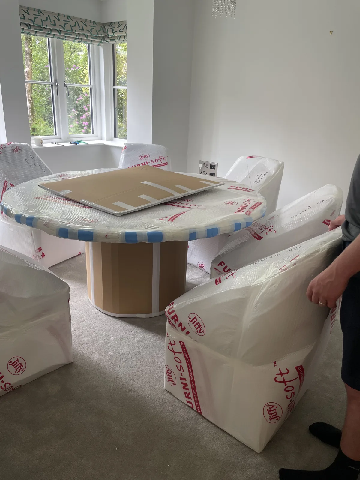 Crew with wrapped furniture and boxes for a Kent removal