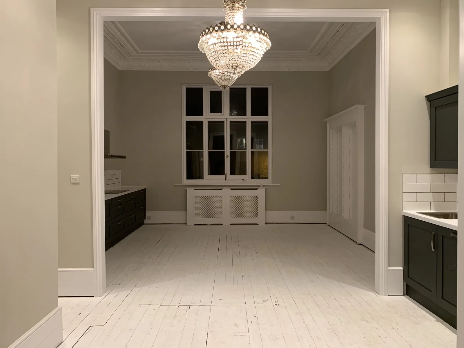A period dining room with chandelier cleared for a move