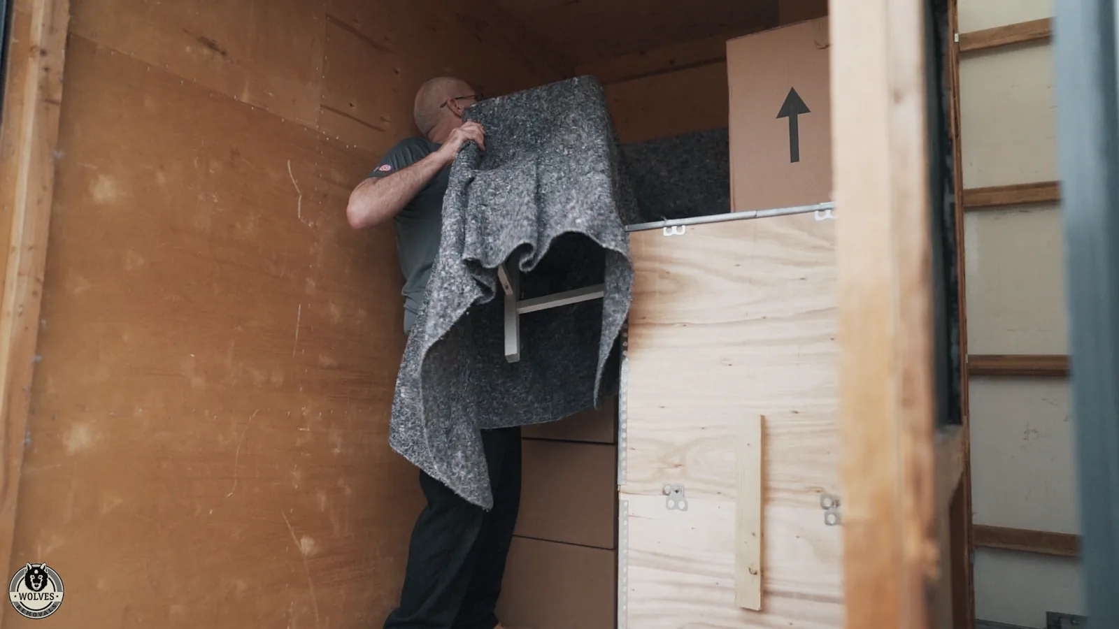 Handling wrapped furniture at the storage barn — a Hove removal