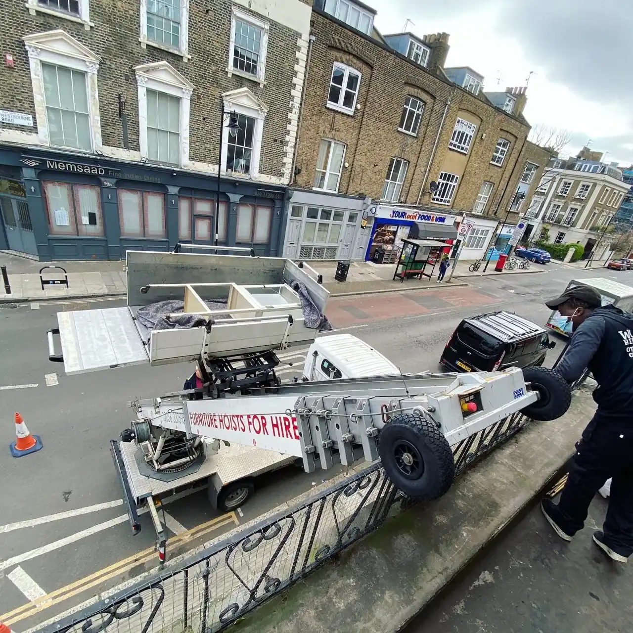 A Wolves Removals crew loading a student's furniture into a van for a small, affordable move
