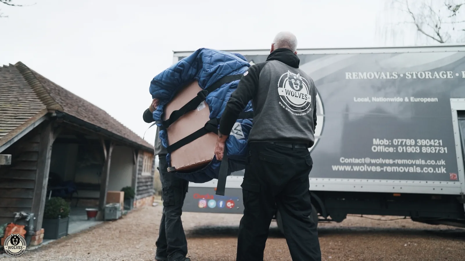 Loading furniture onto a storage van in West Sussex