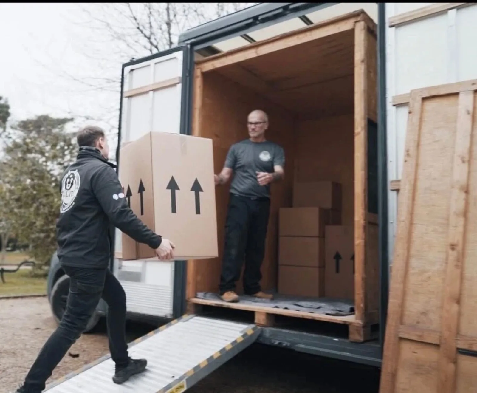 Loading packed boxes into lorry