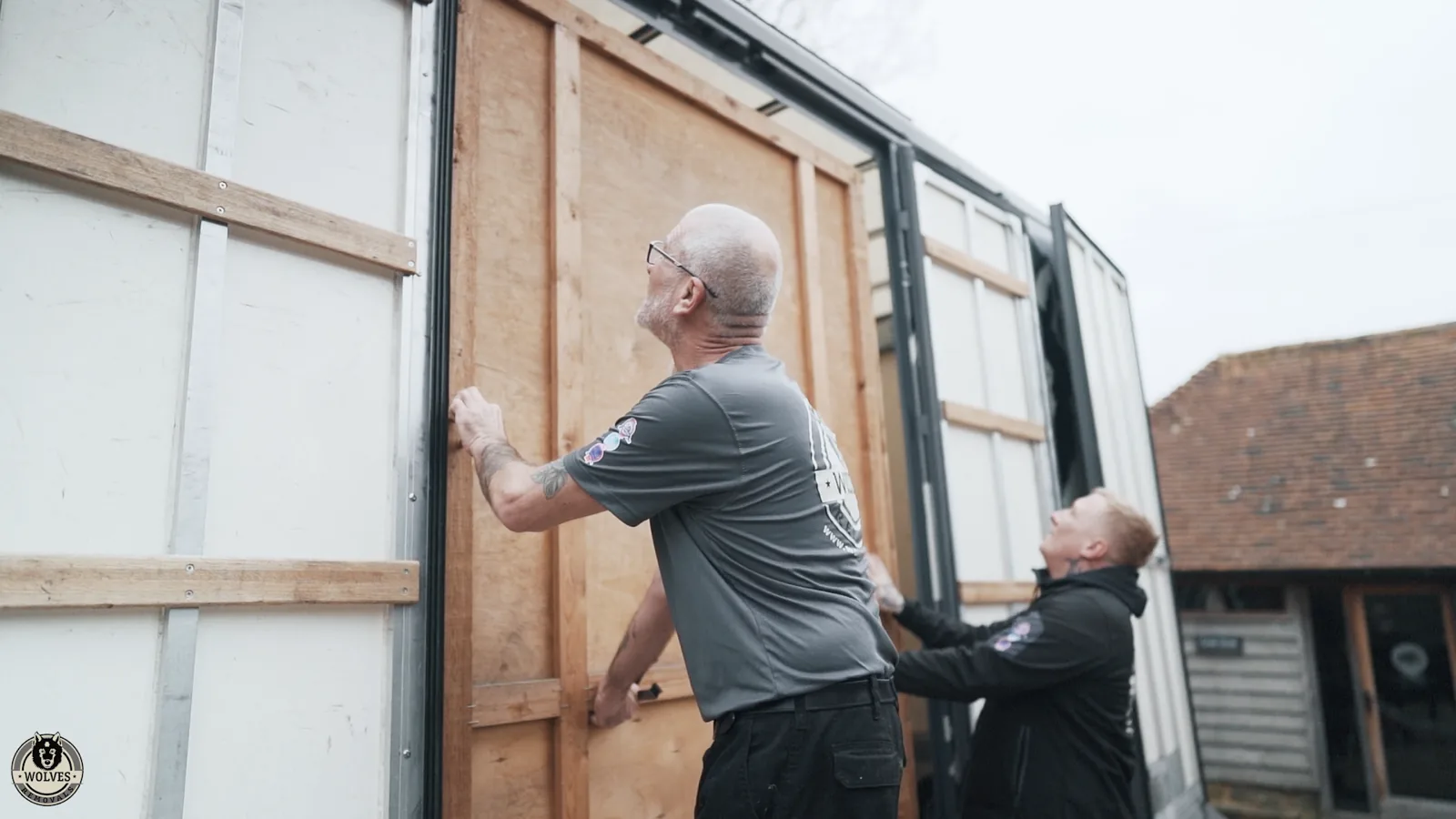 Loading wrapped panels into a storage container in Kent