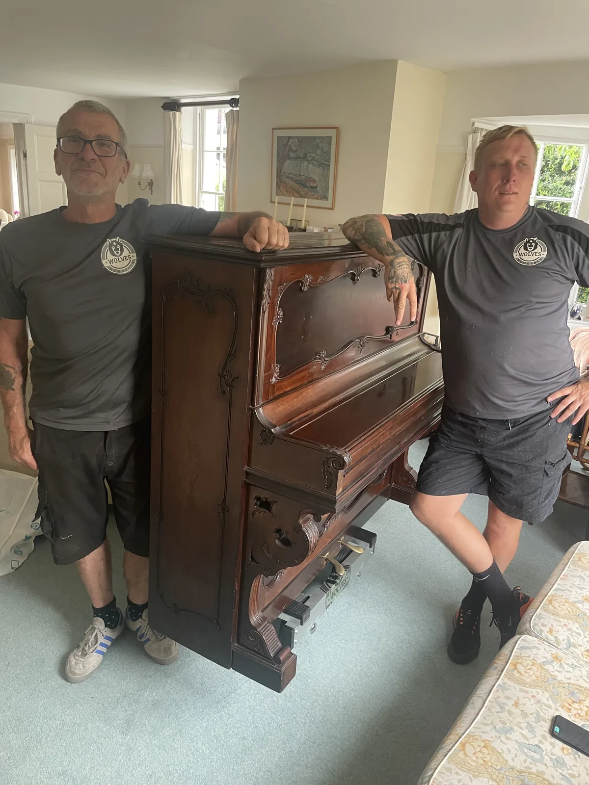Crew member moving an antique chest