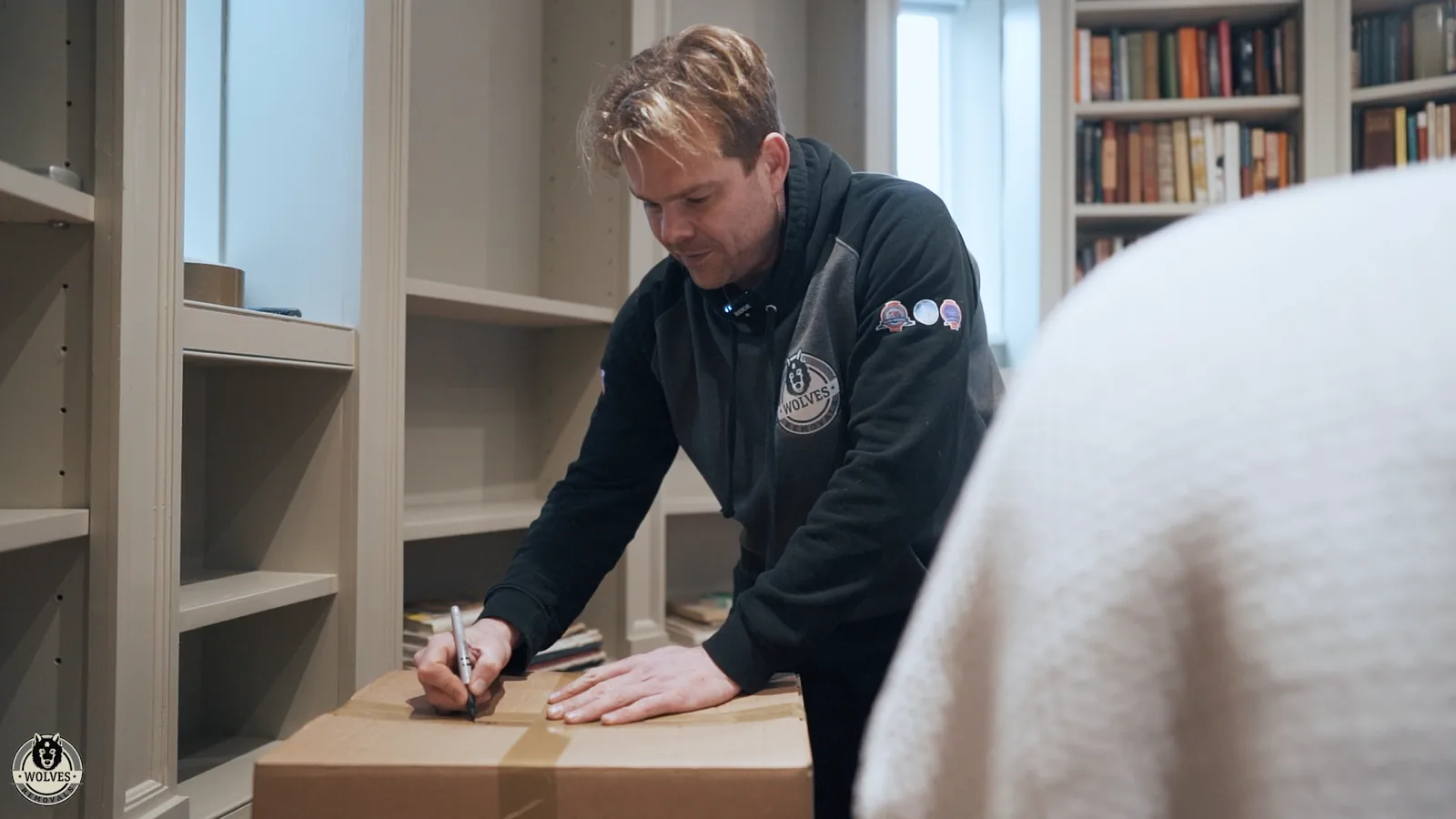 Packing books neatly into moving boxes