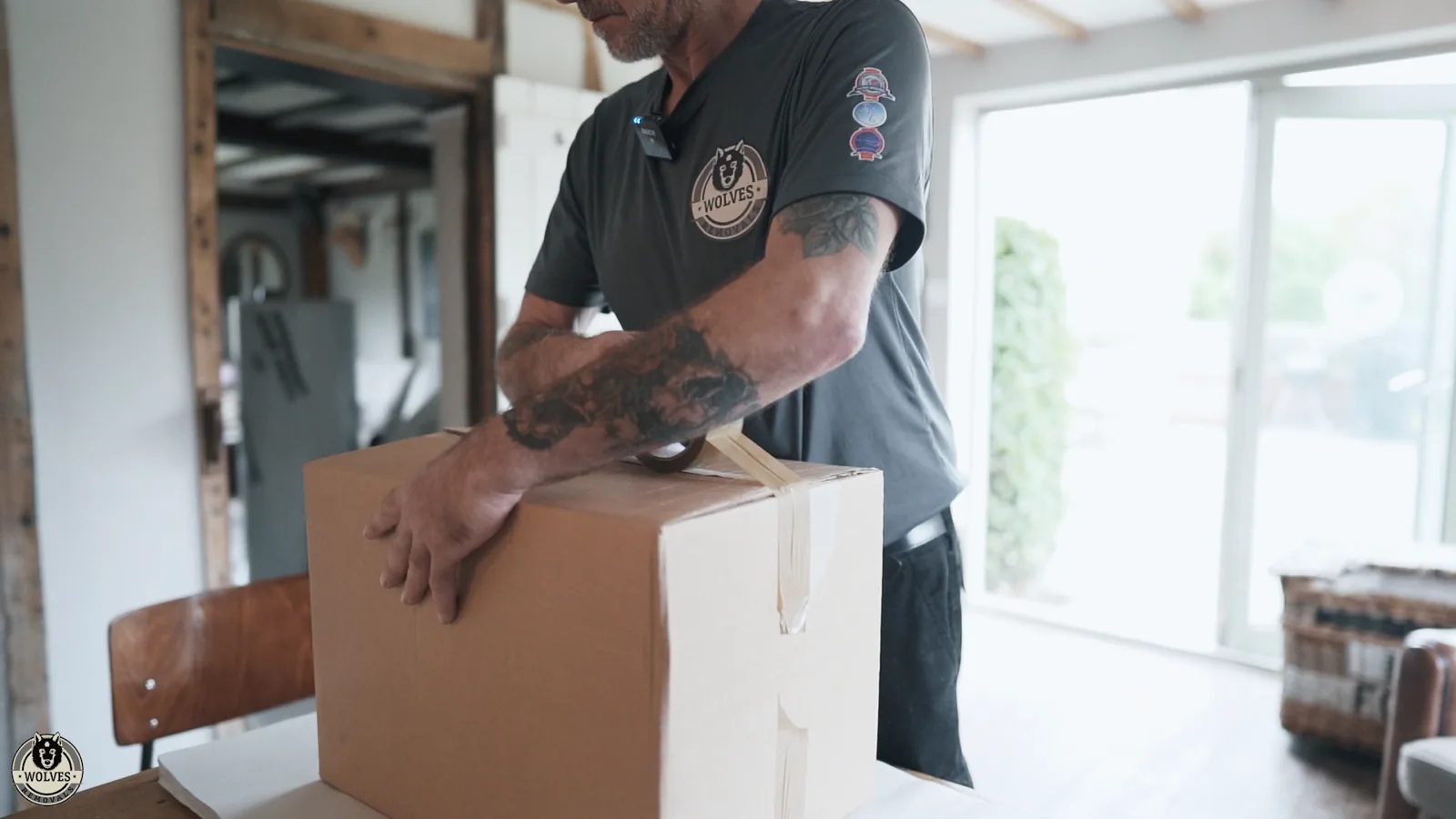 Packing a cardboard box at home on a Kent house move
