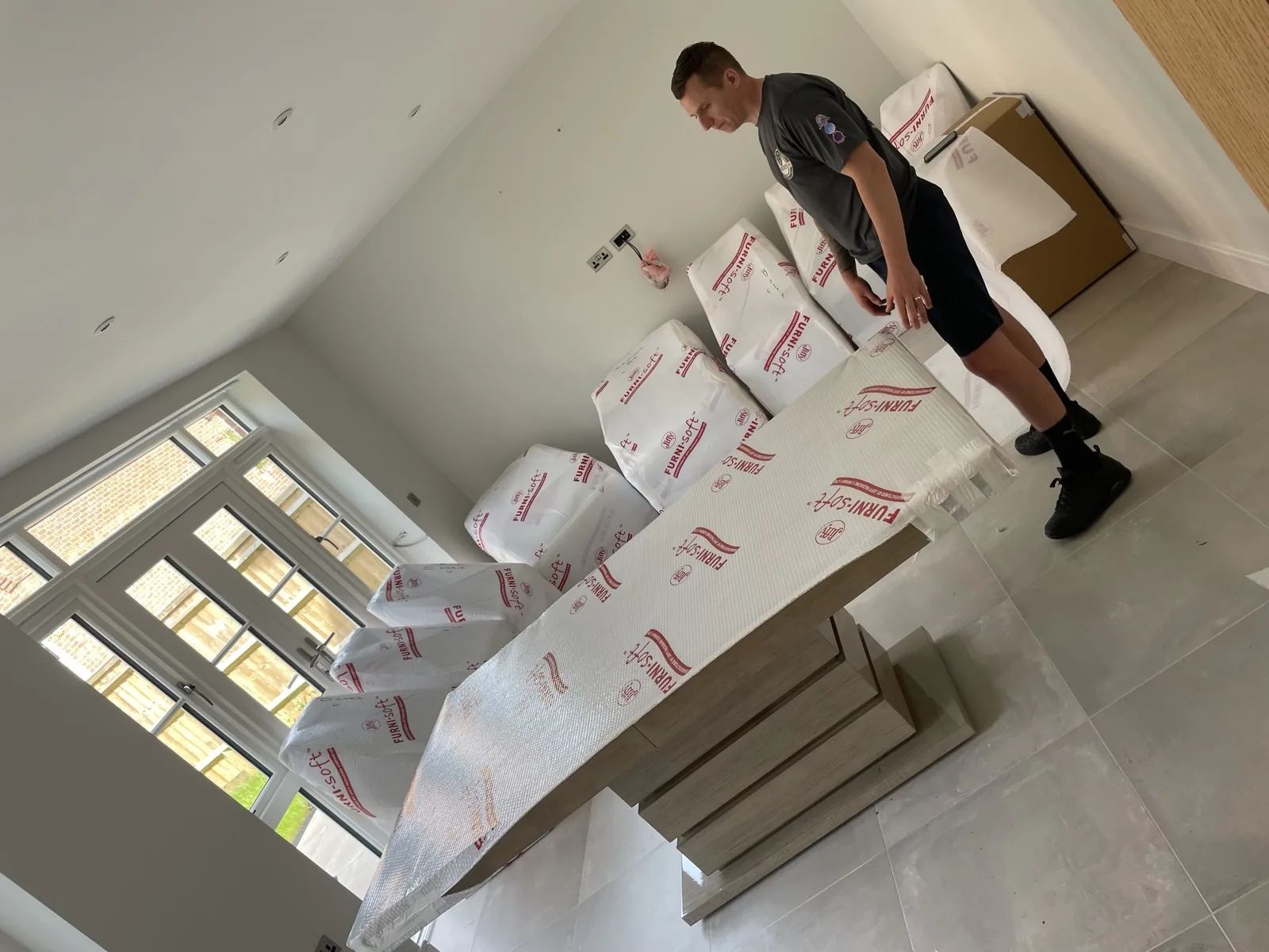 Packing furniture in an attic bedroom for a move in Worthing, West Sussex
