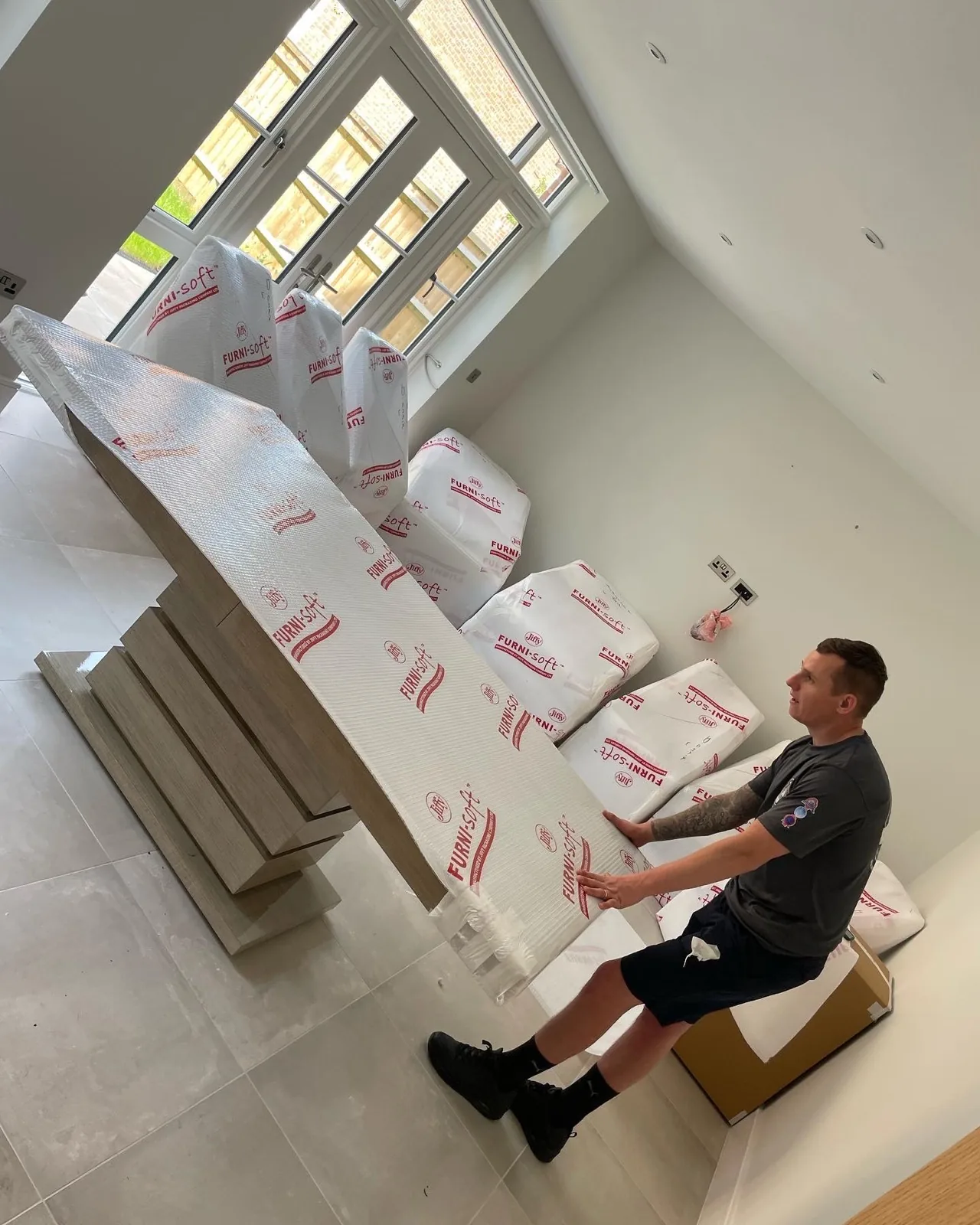 Packing a wrapped bed in the bedroom — a Redhill removal