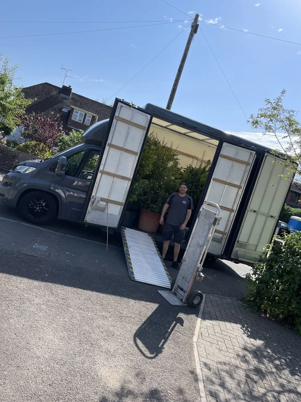 Aerial view of a removal truck on a street, Steyning