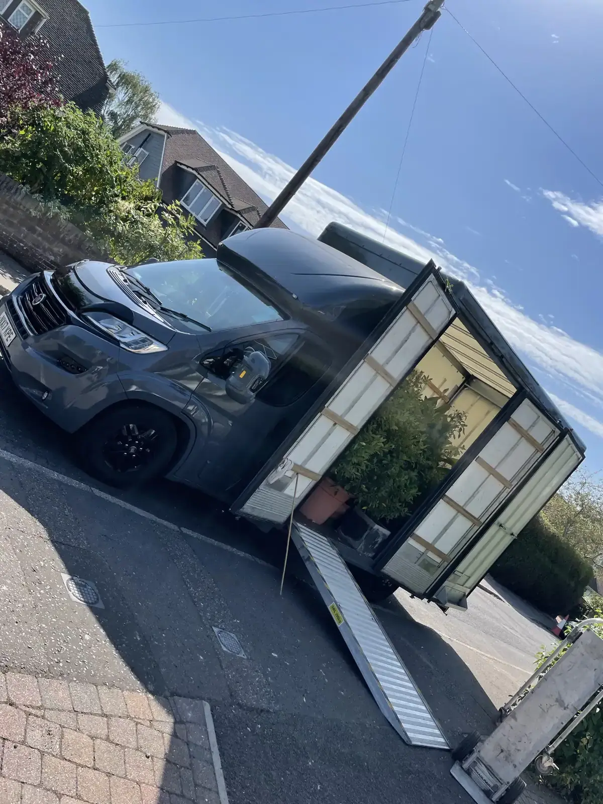 A removal van on a customer's driveway, Hampshire