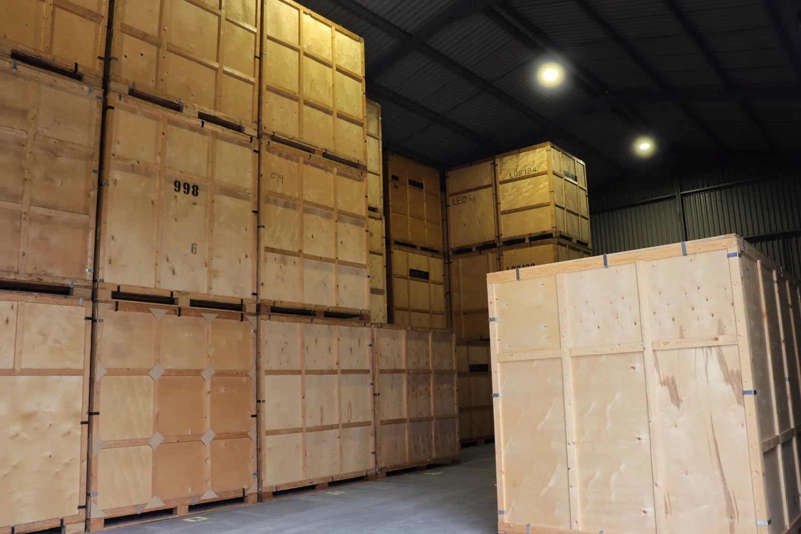 Stacked wooden storage containers in the warehouse on a house move in Kent