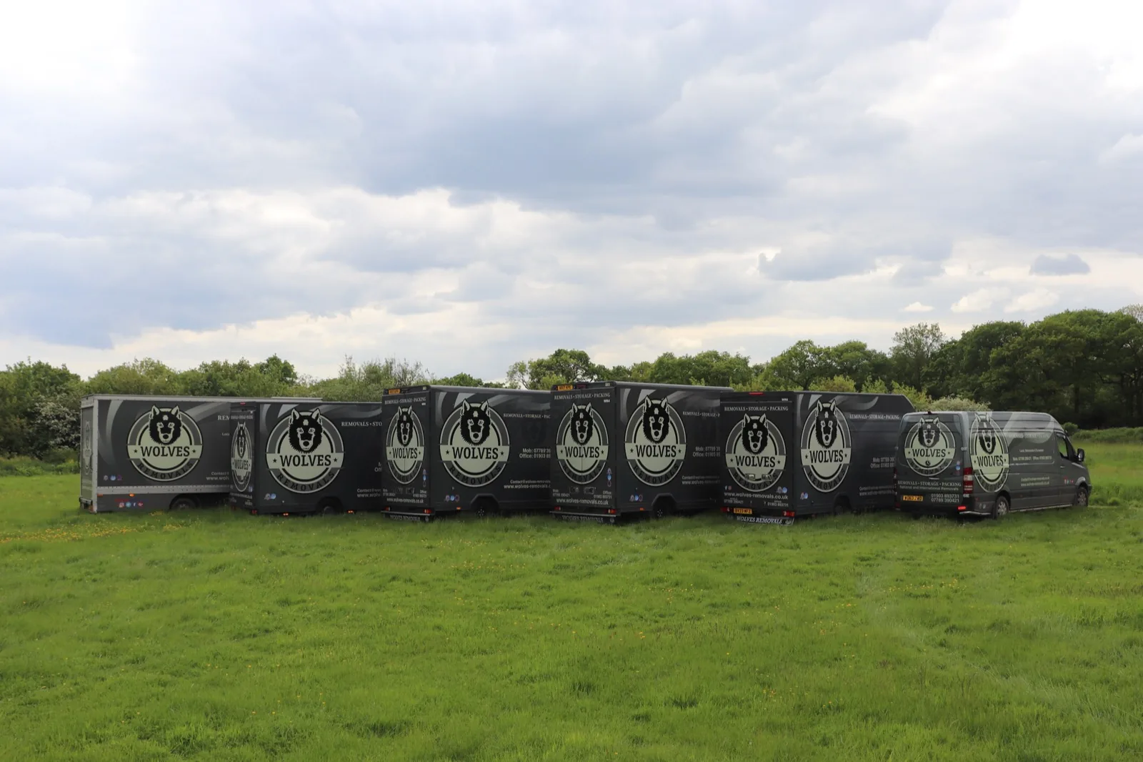 Storage containers lined up in a field in Steyning, West Sussex