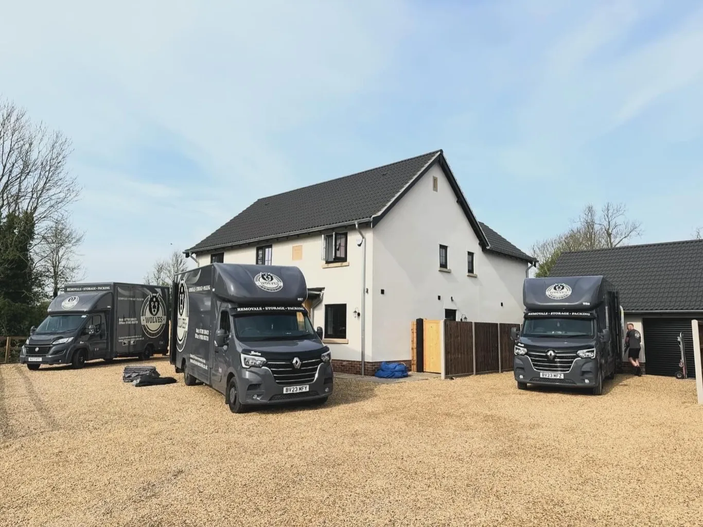 Three Wolves Removals vans outside a large Sussex house