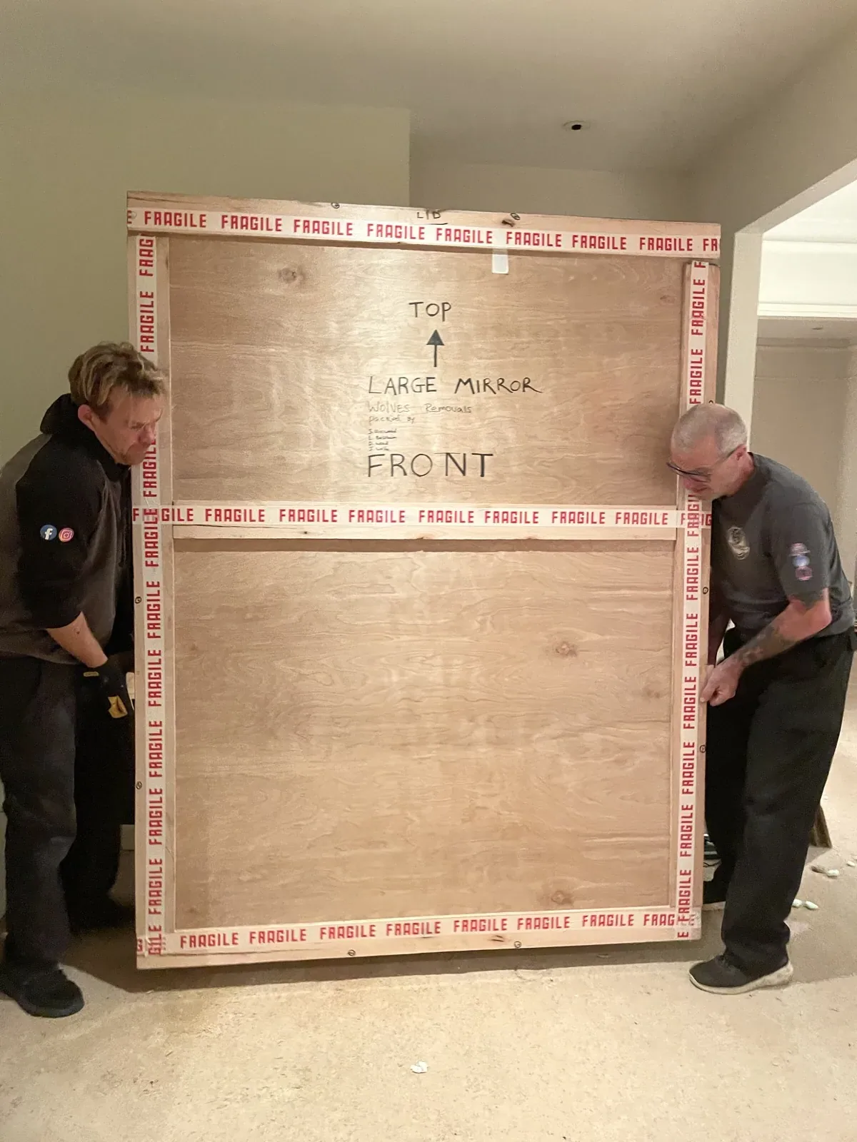 Two movers with a large export crate