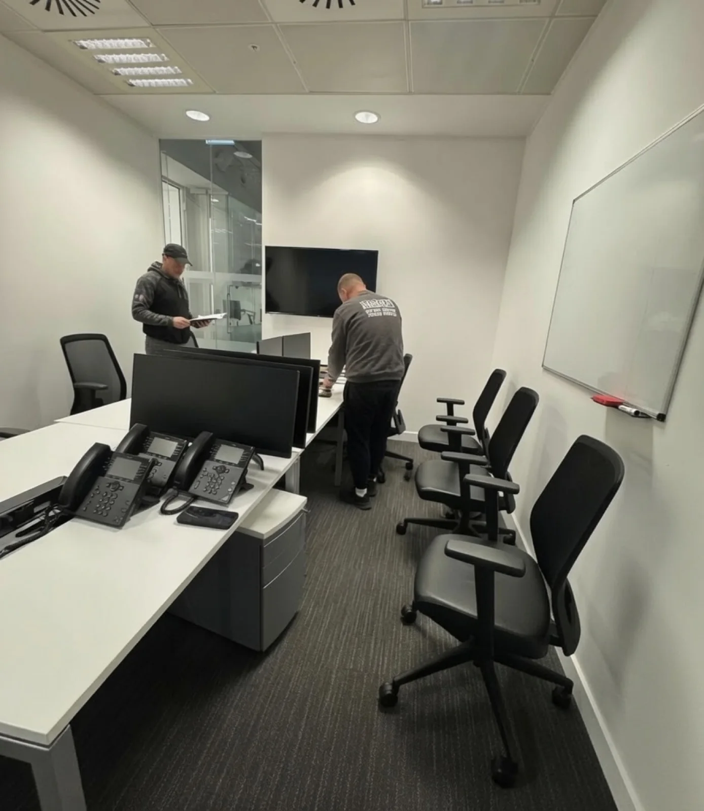 The Wolves Removals crew setting up office furniture and IT equipment between premises