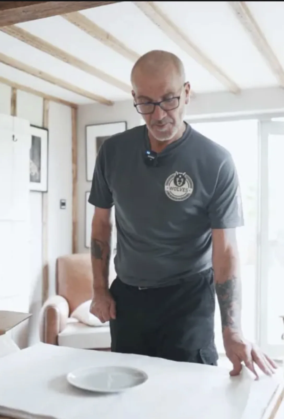 A Wolves Removals team member preparing a dining table for protection on moving day