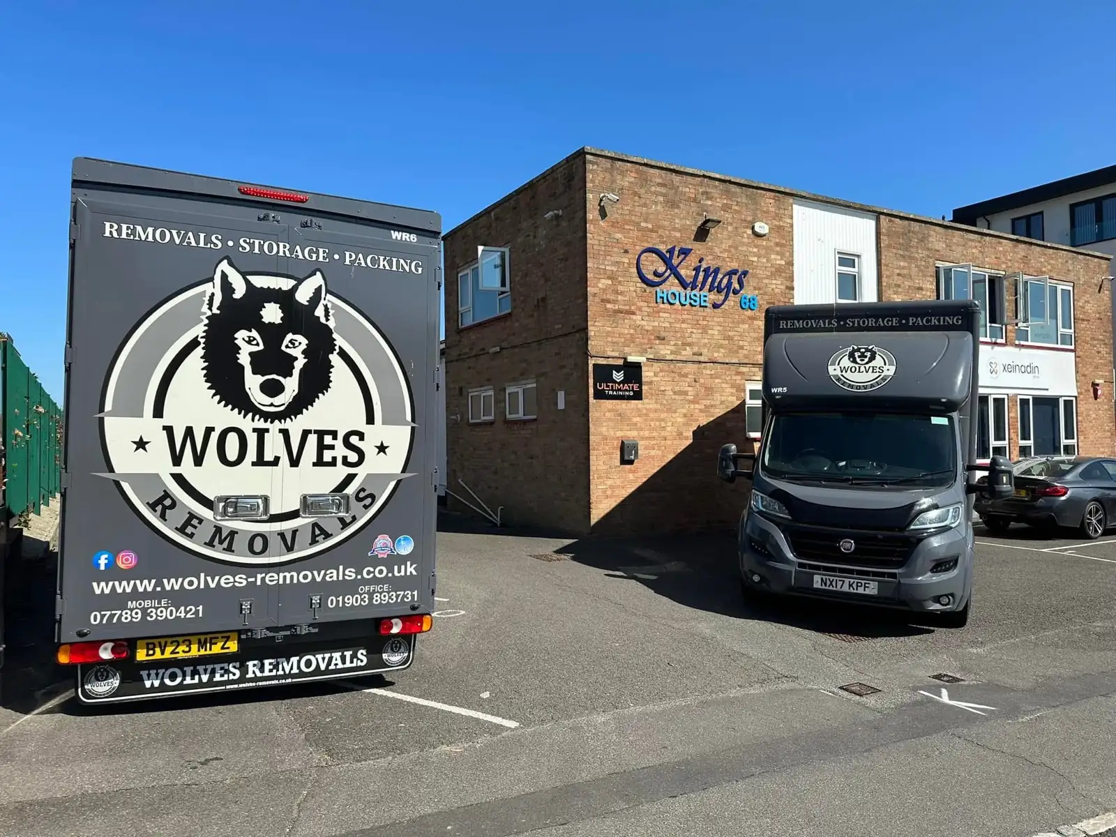 Two Wolves Removals vans parked outside the depot at Kings House