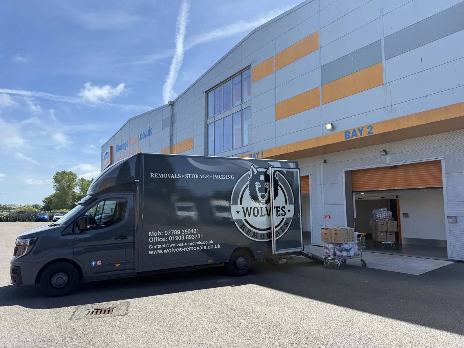 A Wolves Removals van loading at a secure self-storage facility