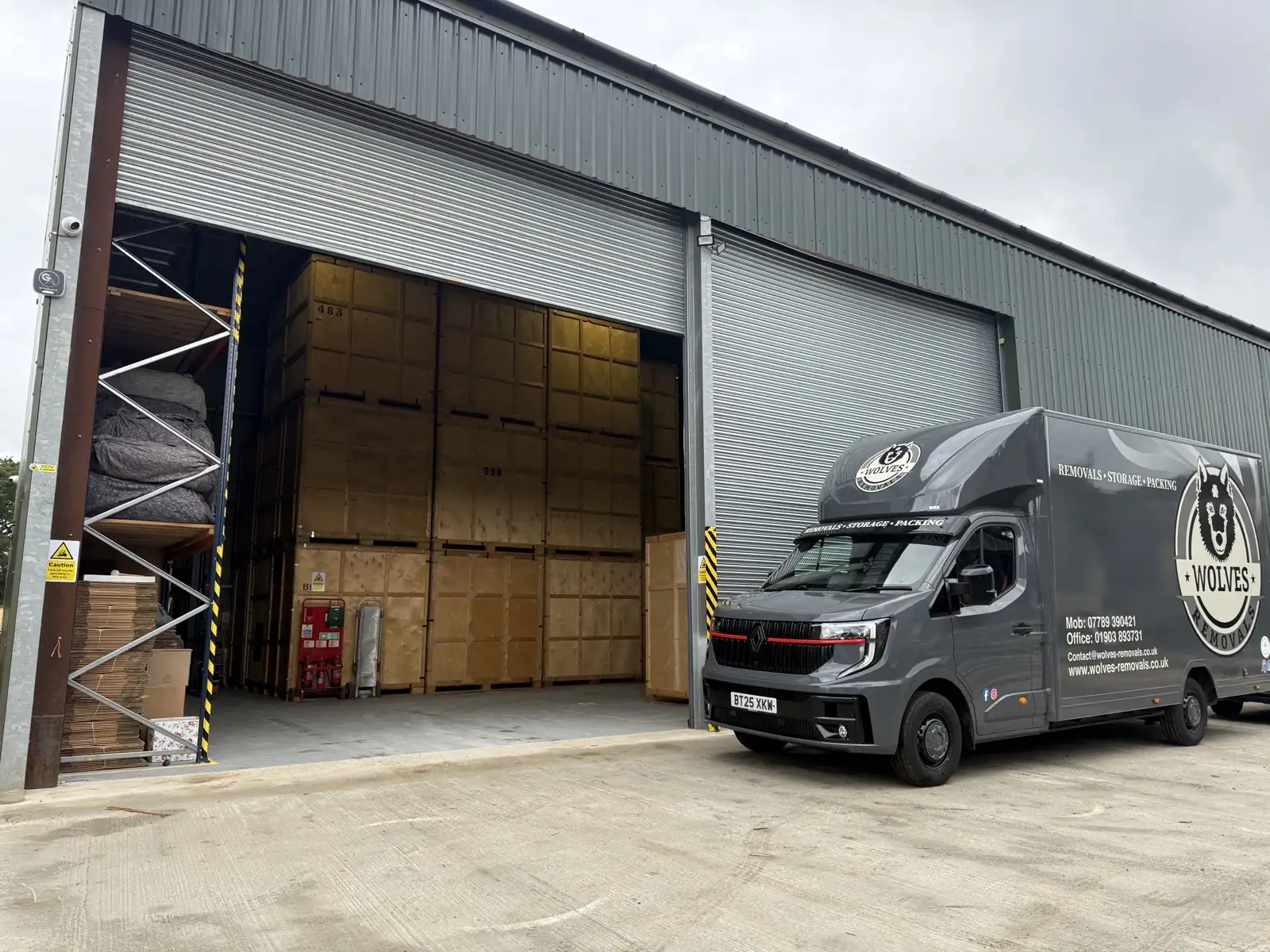 A Wolves Removals van outside the secure storage warehouse doorway