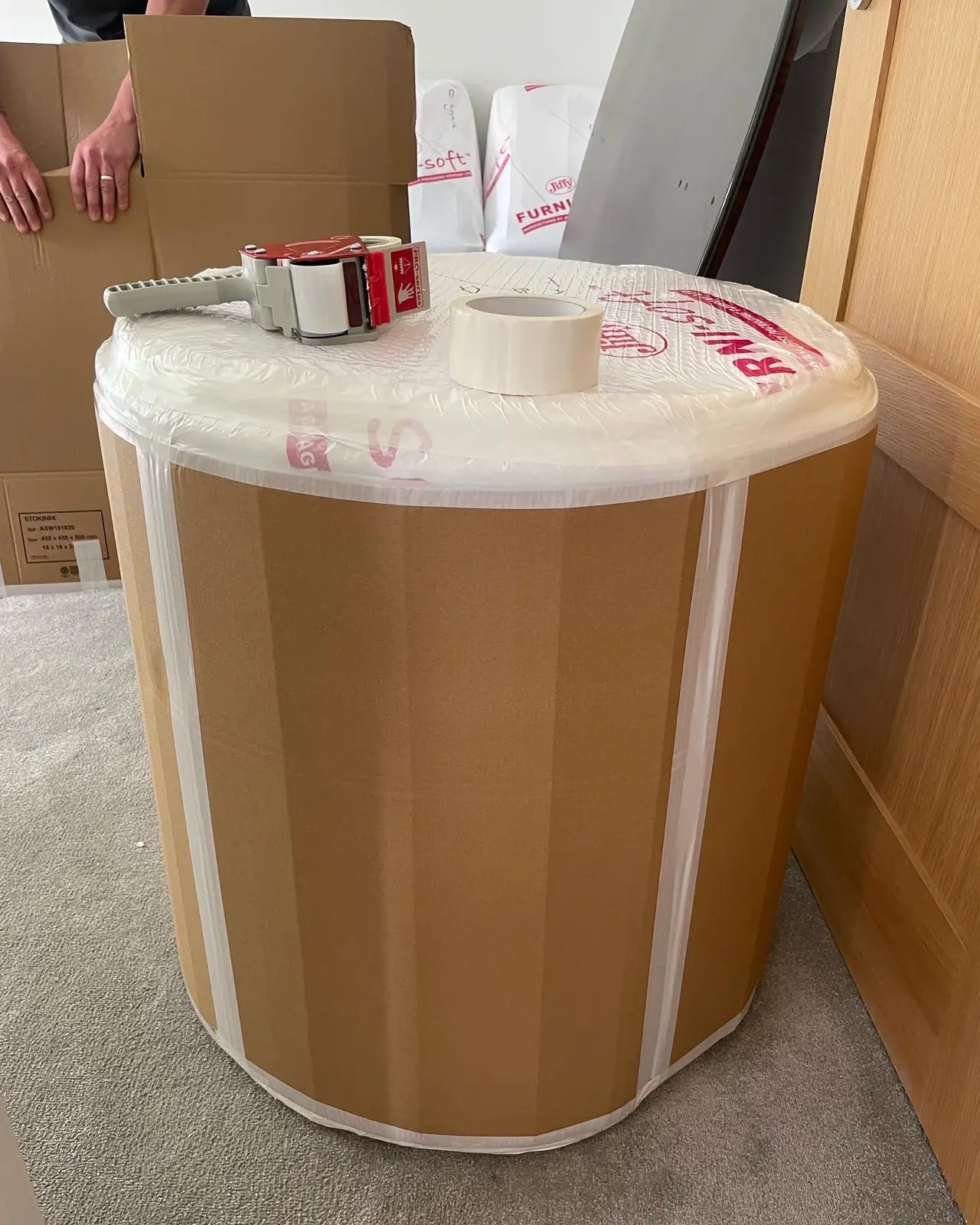 Wrapped antique round table, packed on a house move in Kent