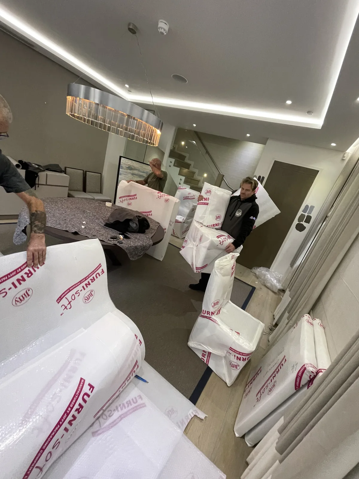 Wrapping sofas in a bright room in Crawley, West Sussex