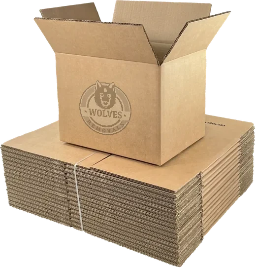 Small double-walled moving box on a stack of flat-packed cartons